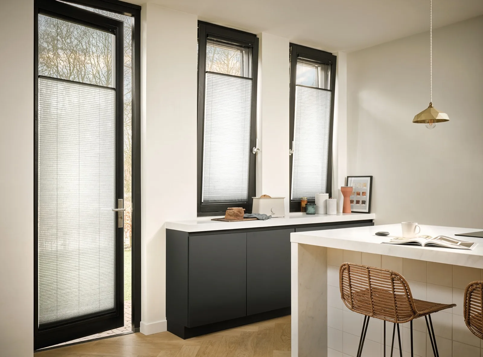Sheer white Duette blinds in a modern kitchen with breakfast bar