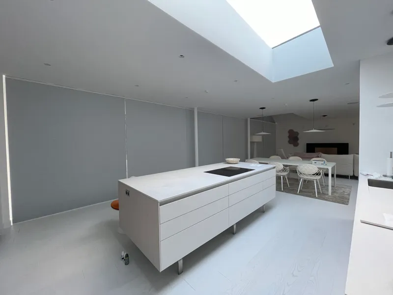 Motorised cellular blinds in a bright interior