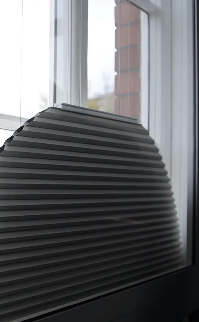 Arched, motorised, stack-at-the-bottom, Duette blind