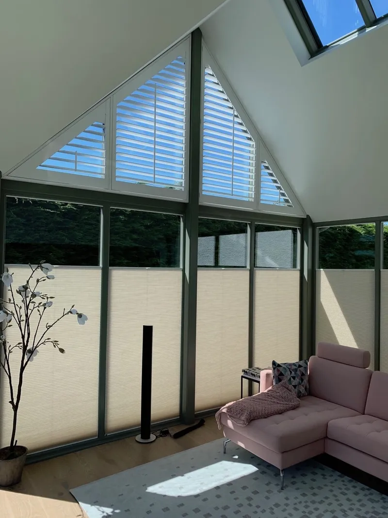 Tensioned Bottom-Up Blinds below Shaped Shutters on a Gable Window