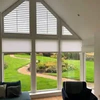 Shaped Shutters on a Gable Window with Blinds Below
