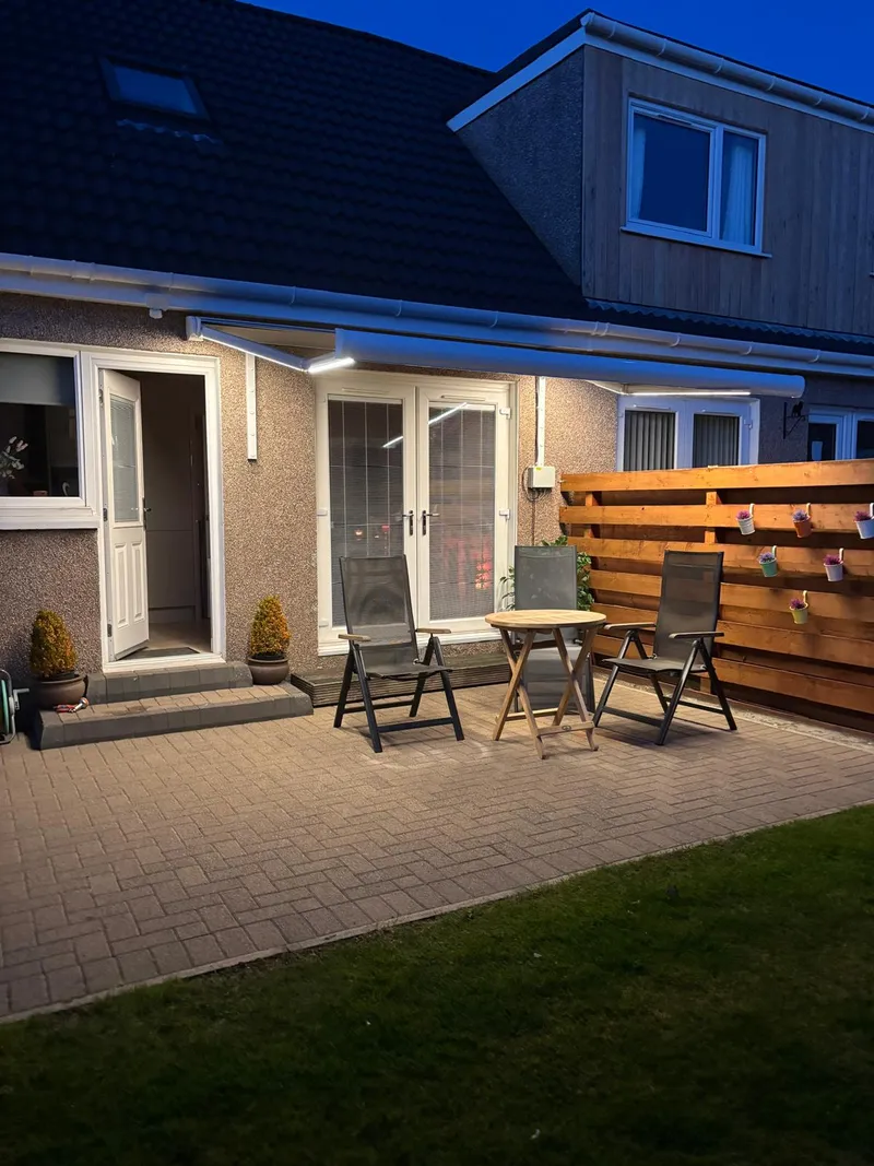 Patio Awning at Night with Arm Lights