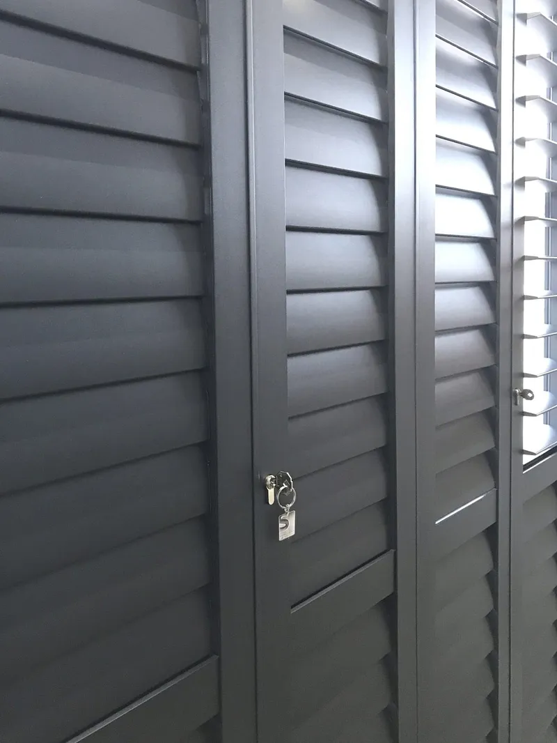 Portchester Security Shutters on a Patio Door finished in Charcoal