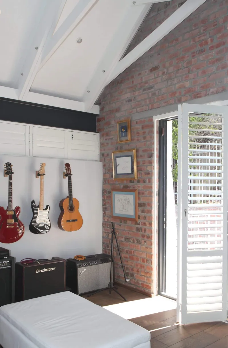 Hinged, Bi-folding Internal Security Shutters  in a Music Room