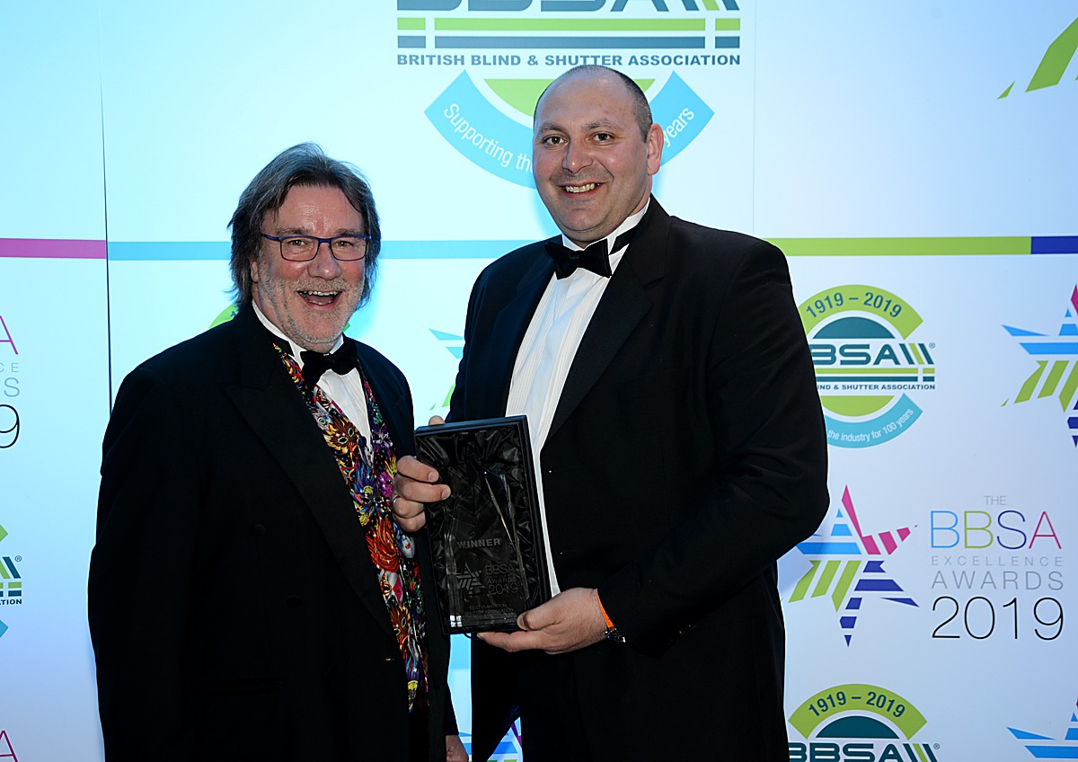 David Browne and David D'Ambrosio in black tie holding the BBSA Excellence Award trophy at the 2019 BBSA Awards, the BBSA centenary year