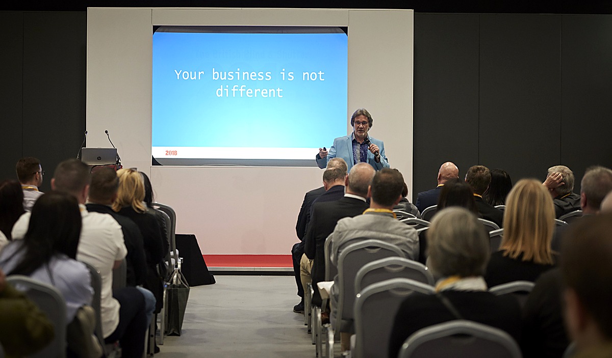 David Browne on stage presenting to a large audience of business owners at the BBSA Show 2018