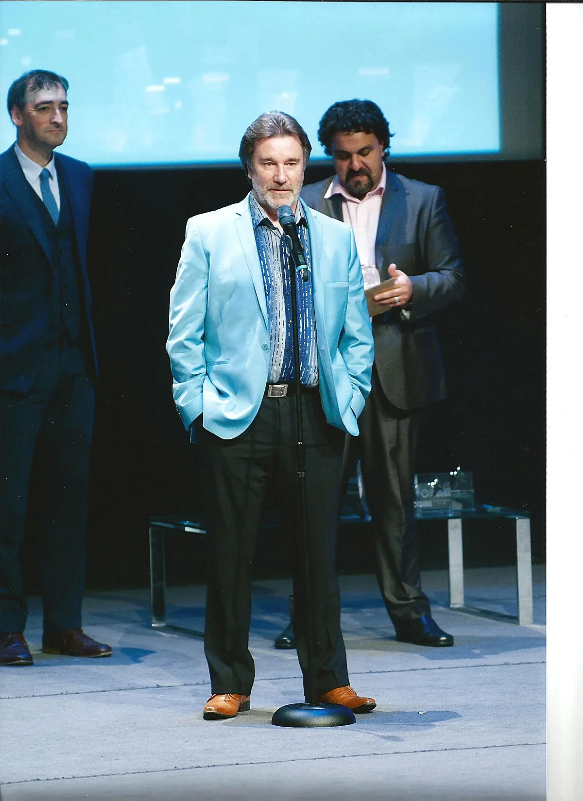 David Browne on stage at the National Convention for Entrepreneurs in Birmingham accepting the Marketing Campaign of the Year award from Raz Razak