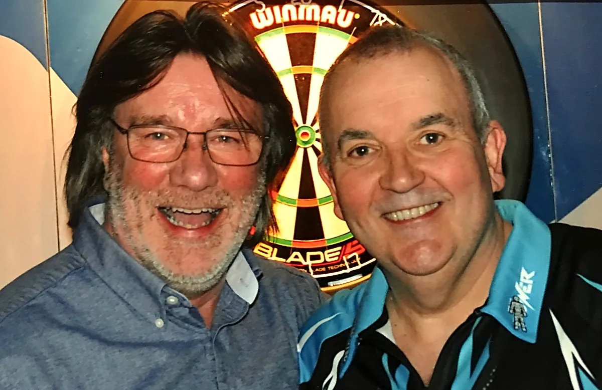 David Browne with Phil "The Power" Taylor in front of a Winmau dartboard