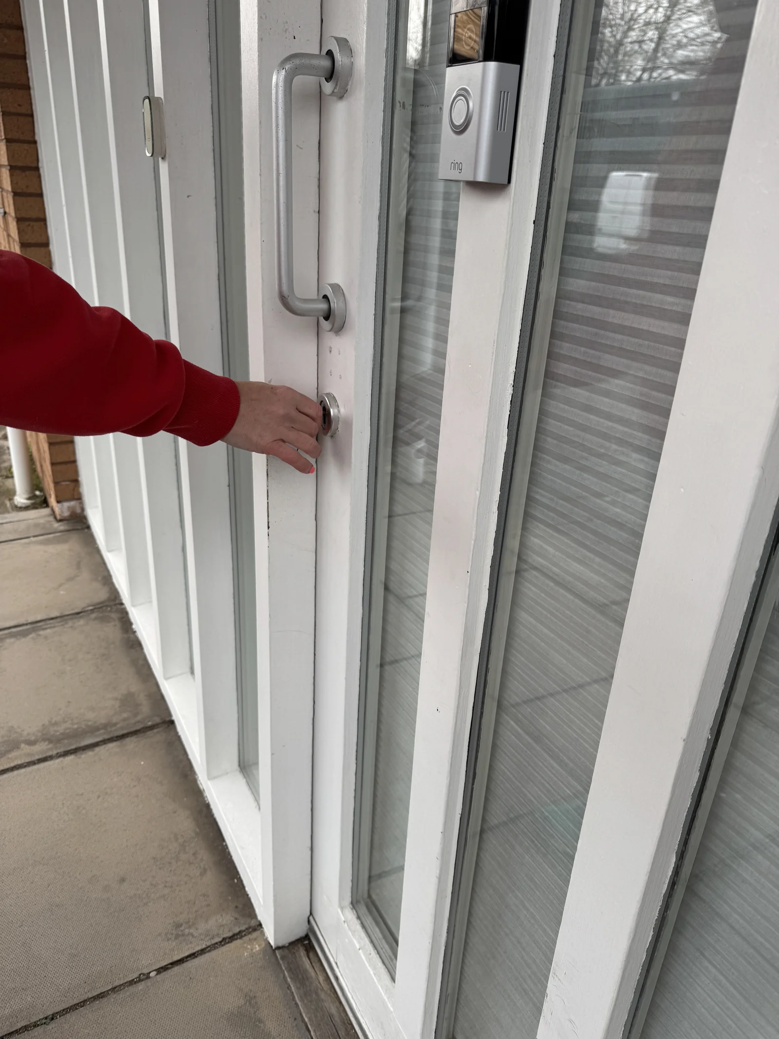 Judith locking the front door of the Dundee Design Studio on Ainslie Street for the last time after 17 years